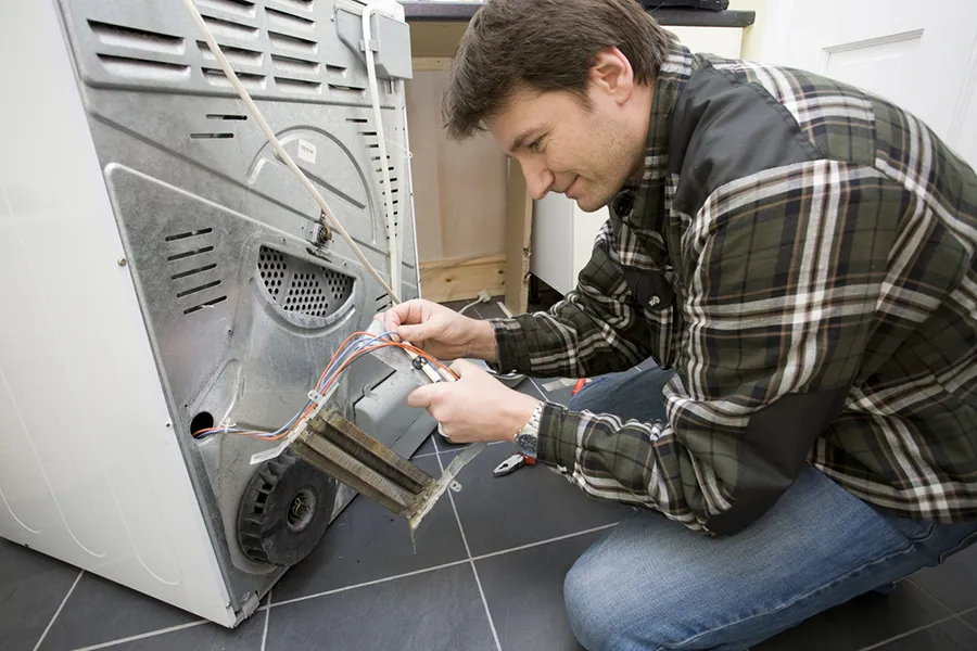 Ken repairing a dryer